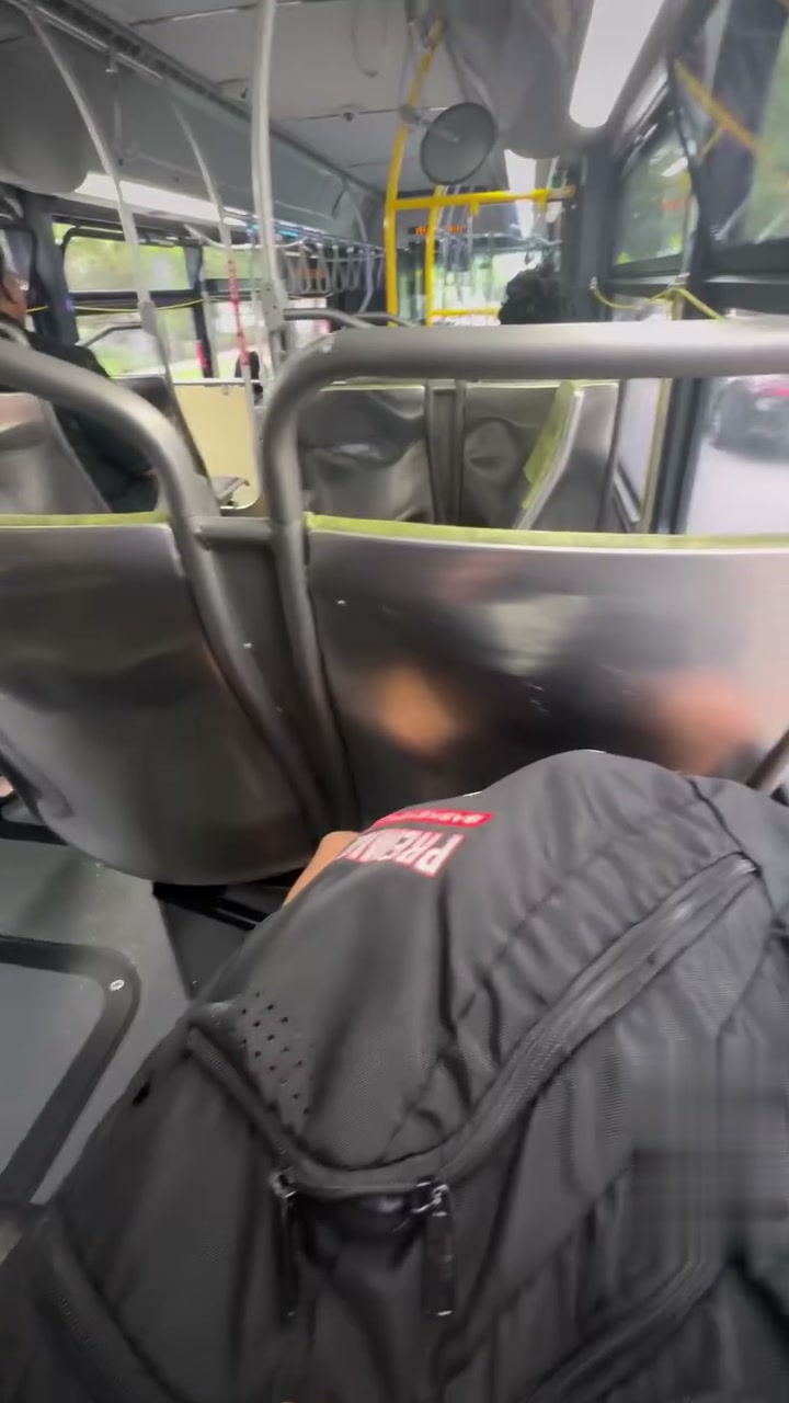 Riding the Metro bus on the way home, backpack on the seat